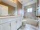 Updated bathroom with white vanity and a bathtub at 2510 Black Lake Blvd, Winter Garden, FL 34787