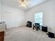 Bright bedroom with carpet flooring, double closets, and window coverings at 2510 Black Lake Blvd, Winter Garden, FL 34787