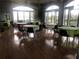 Bright community room with large windows, hardwood floors, and tables at 2510 Black Lake Blvd, Winter Garden, FL 34787