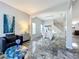 Modern dining room with white table and chairs, marble floors at 2510 Black Lake Blvd, Winter Garden, FL 34787