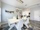 Modern dining room with white table and chairs and chandelier at 2510 Black Lake Blvd, Winter Garden, FL 34787