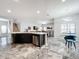 Open concept kitchen with island and views into adjacent living area at 2510 Black Lake Blvd, Winter Garden, FL 34787