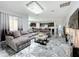 Open living room showcasing a sectional sofa and marble flooring at 2510 Black Lake Blvd, Winter Garden, FL 34787