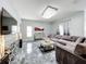 Spacious living room with large sectional sofa and modern decor at 2510 Black Lake Blvd, Winter Garden, FL 34787