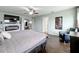 Main bedroom featuring a fireplace, large bed, and hardwood floors at 2510 Black Lake Blvd, Winter Garden, FL 34787