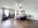 Large main bedroom with dark hardwood floors and a ceiling fan at 2510 Black Lake Blvd, Winter Garden, FL 34787