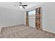 Bedroom with ceiling fan, patterned curtains, and carpeted floor at 4132 Yorketowne Rd, Orlando, FL 32812