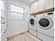 Bright laundry room, complete with washer and dryer at 548 Hearthglen Blvd, Winter Garden, FL 34787