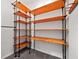 Custom closet shelving with wood shelves and black metal pipes at 548 Hearthglen Blvd, Winter Garden, FL 34787