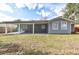 Newly renovated house with covered patio, fenced backyard, and large grassy area at 58 Pine Trl, Ormond Beach, FL 32174