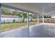 Covered patio with concrete flooring and view of the backyard at 58 Pine Trl, Ormond Beach, FL 32174