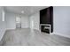 Living room with fireplace and gray vinyl flooring at 58 Pine Trl, Ormond Beach, FL 32174