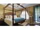 Bedroom with canopy bed and window seating at 607 Pensacola Ln, Lake Mary, FL 32746