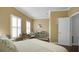 Bedroom with a green cabinet and wicker chairs at 607 Pensacola Ln, Lake Mary, FL 32746
