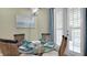 Casual dining area with glass-top table and French doors to outdoors at 607 Pensacola Ln, Lake Mary, FL 32746