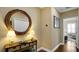 Bright entryway with a decorative mirror and console table at 607 Pensacola Ln, Lake Mary, FL 32746