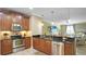 Modern kitchen with stainless steel appliances and granite countertops at 607 Pensacola Ln, Lake Mary, FL 32746