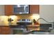 Stainless steel stove and microwave in this well-lit kitchen at 607 Pensacola Ln, Lake Mary, FL 32746