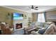 Living room with sectional sofa and fireplace at 607 Pensacola Ln, Lake Mary, FL 32746