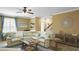 Spacious living room featuring a large sectional sofa and a fireplace at 607 Pensacola Ln, Lake Mary, FL 32746