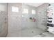 Walk-in shower with glass enclosure, tiled walls and built-in shelving at 609 Big Pine Ave, Minneola, FL 34715