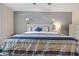 Main bedroom with a large bed and side tables at 612 Shoal Creek Dr, Ocoee, FL 34761