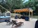 Relaxing patio with pergola, hot tub, and seating area at 612 Shoal Creek Dr, Ocoee, FL 34761