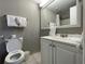 Clean bathroom with toilet, sink, and vanity at 6165 Carrier Dr # 2401, Orlando, FL 32819