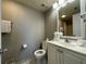 Clean bathroom with toilet and sink at 6165 Carrier Dr # 2401, Orlando, FL 32819