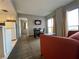 Living room with sofa, dining table, and kitchen at 6165 Carrier Dr # 2401, Orlando, FL 32819
