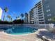 Resort style pool with plenty of lounge chairs at 6165 Carrier Dr # 2401, Orlando, FL 32819