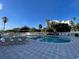 Relaxing kidney-shaped pool with surrounding patio at 6165 Carrier Dr # 2401, Orlando, FL 32819