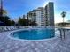 Resort-style pool with plenty of lounge chairs at 6165 Carrier Dr # 2401, Orlando, FL 32819