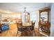 Dining area with wood table and chairs, and a wood display cabinet at 6522 Glen Meadow Loop, Lakeland, FL 33810