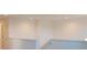 Upstairs hallway with white walls and carpeted flooring at 6805 Serpent Hawk Lane St, Howey In The Hills, FL 34737