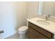 Small bathroom with single vanity, toilet, and white quartz countertop at 6858 Spanish Imperial St, Howey In The Hills, FL 34737