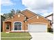 Two-story house with a two-car garage at 1250 Willow Branch Dr, Orlando, FL 32828