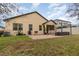 House exterior and backyard with patio and lawn at 1380 Clear Brook Pl, St Cloud, FL 34772