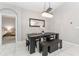 Dining room with dark wood table, bench, and chandelier at 1380 Clear Brook Pl, St Cloud, FL 34772