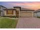 House exterior at dusk with landscaping and driveway at 1380 Clear Brook Pl, St Cloud, FL 34772