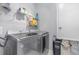 Laundry room with washer, dryer, and shelving at 1380 Clear Brook Pl, St Cloud, FL 34772