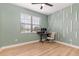 Home office with wood-look flooring and built-in shelving at 1380 Clear Brook Pl, St Cloud, FL 34772