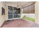 Brick patio with seating area, string lights, and game at 1380 Clear Brook Pl, St Cloud, FL 34772
