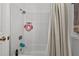 Simple bathroom with shower/tub combo and neutral decor at 1409 Lake Marion Dr, Apopka, FL 32712