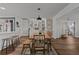 Kitchen features a dining area with white cabinets and wooden table at 1409 Lake Marion Dr, Apopka, FL 32712