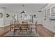 Open concept dining room with kitchen view and wooden table at 1409 Lake Marion Dr, Apopka, FL 32712