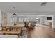 Open concept dining area with wooden table and bench seating at 1409 Lake Marion Dr, Apopka, FL 32712