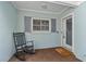 Front porch with rocking chair, inviting entryway, and welcome mat at 1409 Lake Marion Dr, Apopka, FL 32712
