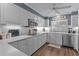 Bright eat-in kitchen, featuring stainless steel appliances and ample cabinetry at 1409 Lake Marion Dr, Apopka, FL 32712