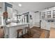 Modern kitchen with stainless steel appliances and white cabinetry at 1409 Lake Marion Dr, Apopka, FL 32712